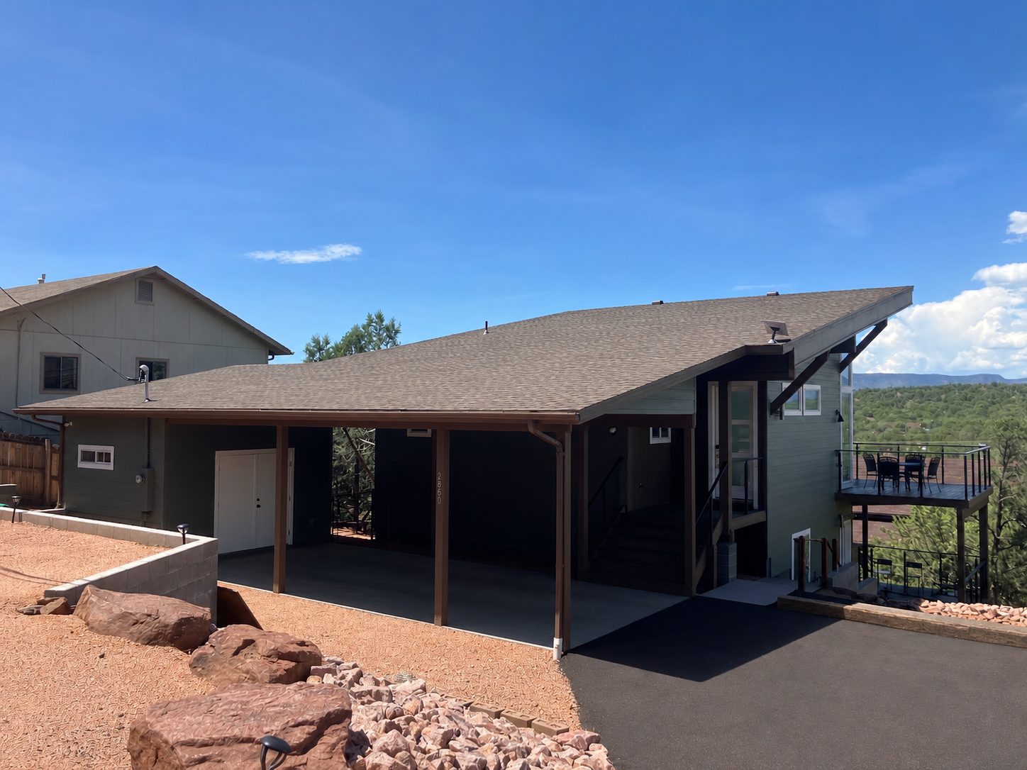 Carport and exterior of a custom hillside home built by Gila Home Solutions in Payson, Arizona
