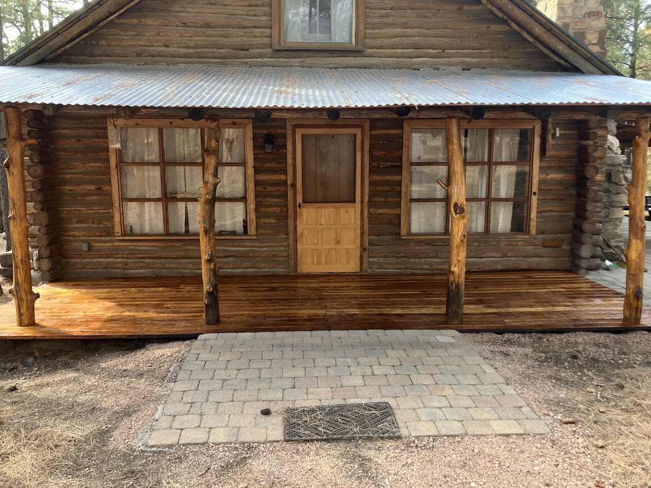 Deck staining and window trim on a Rim Country cabin project by Gila Home Solutions